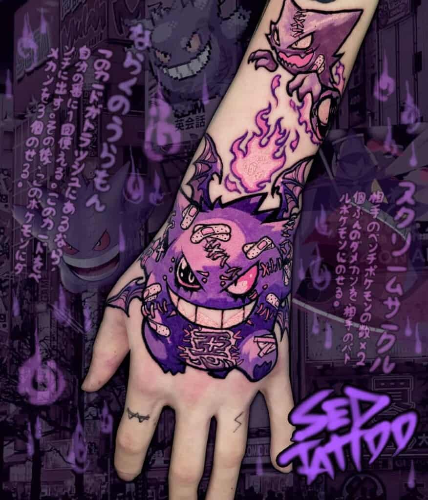 Pokemon Gengar tattoo design on the top of the hand.