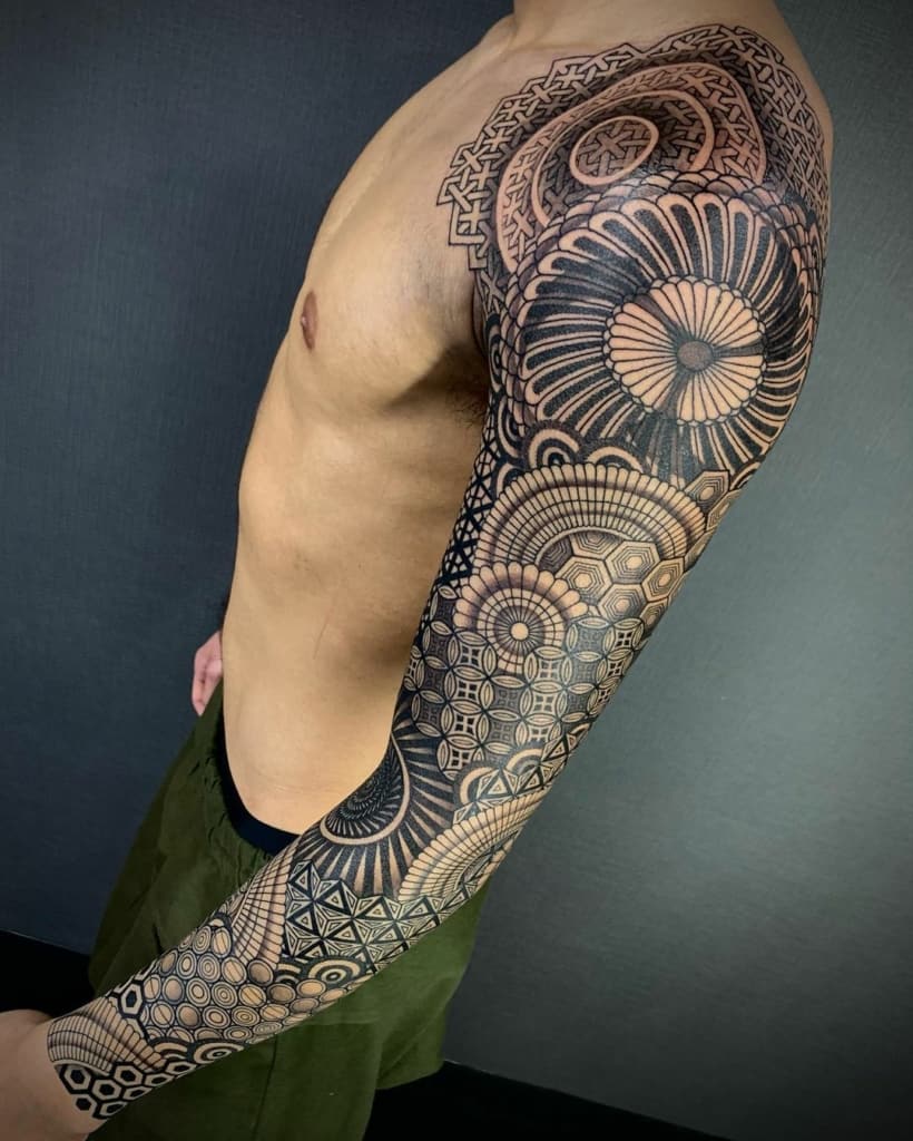 Full-sleeve sacred geometry tattoo