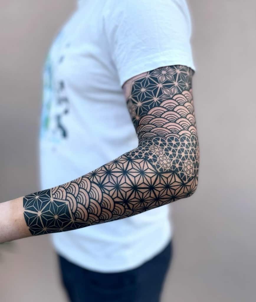 Beautiful geometric sleeve tattoo