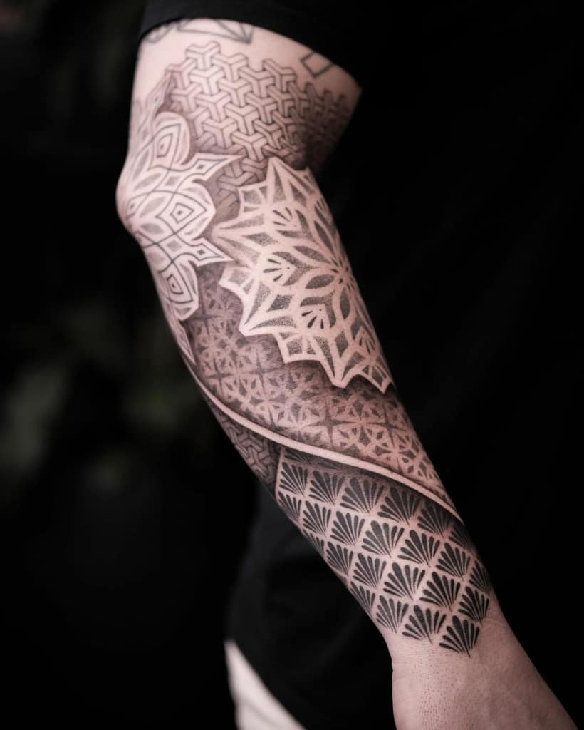 Ornamental tattoo combined with geometry tattoo