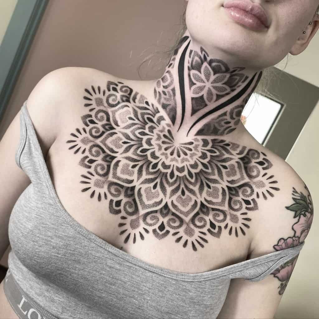 Geometric tattoo with floral pattern on neck and chest