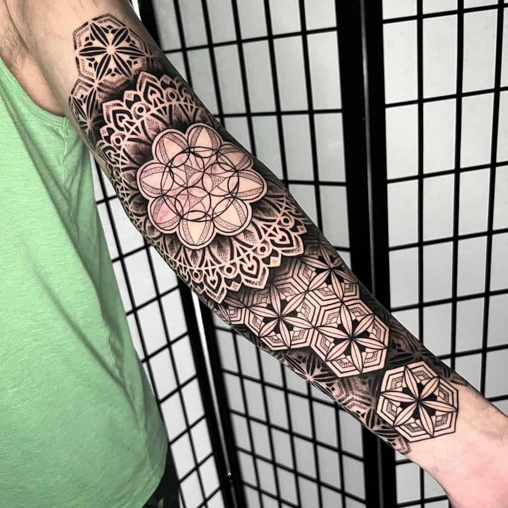 Black geometric mandala tattoo