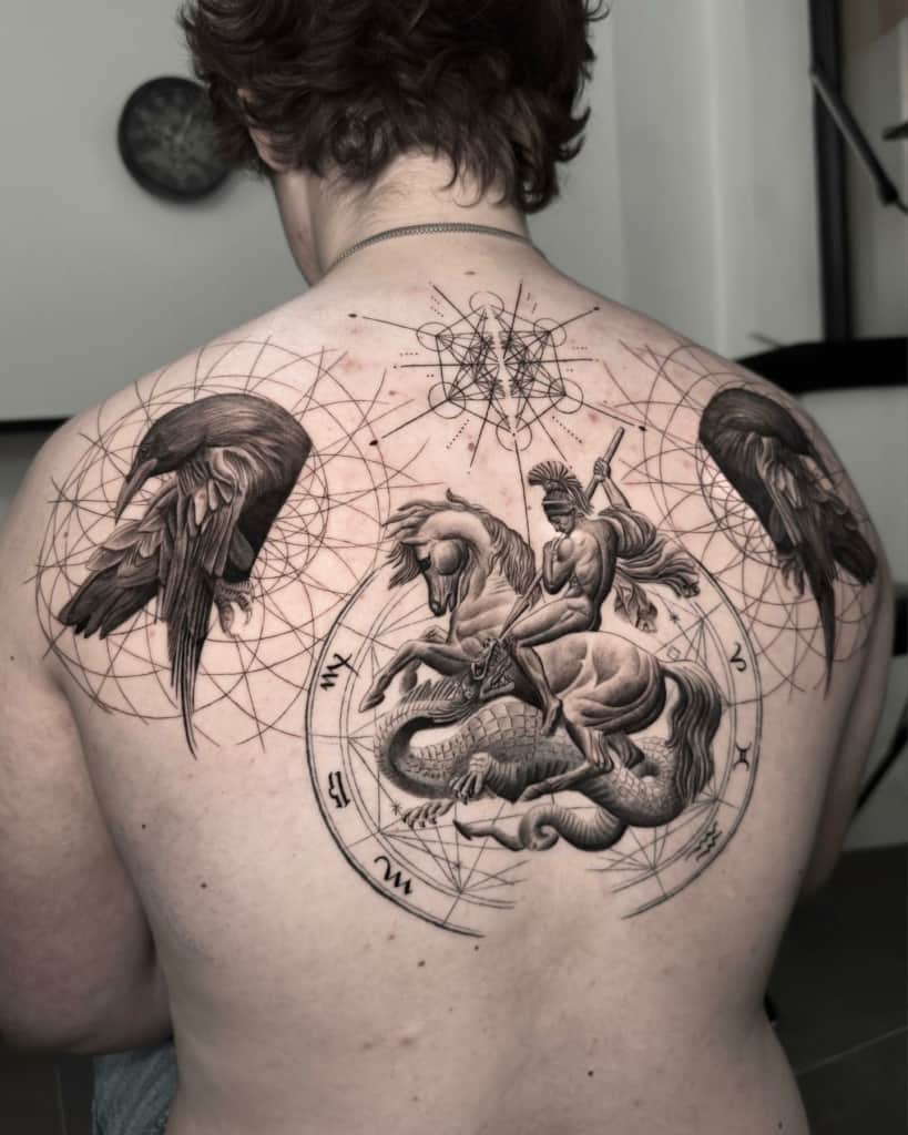Sacred geometry tattoo focused on two crows and art